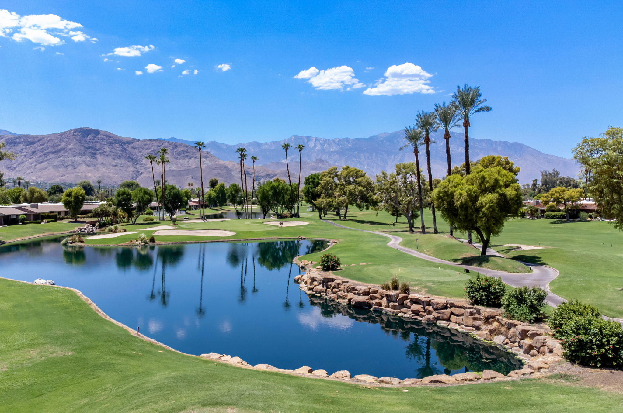Undisclosed Address Rancho Mirage, CA 92270 - Photo 52 of 52 a view of a lake with a mountain in the background
