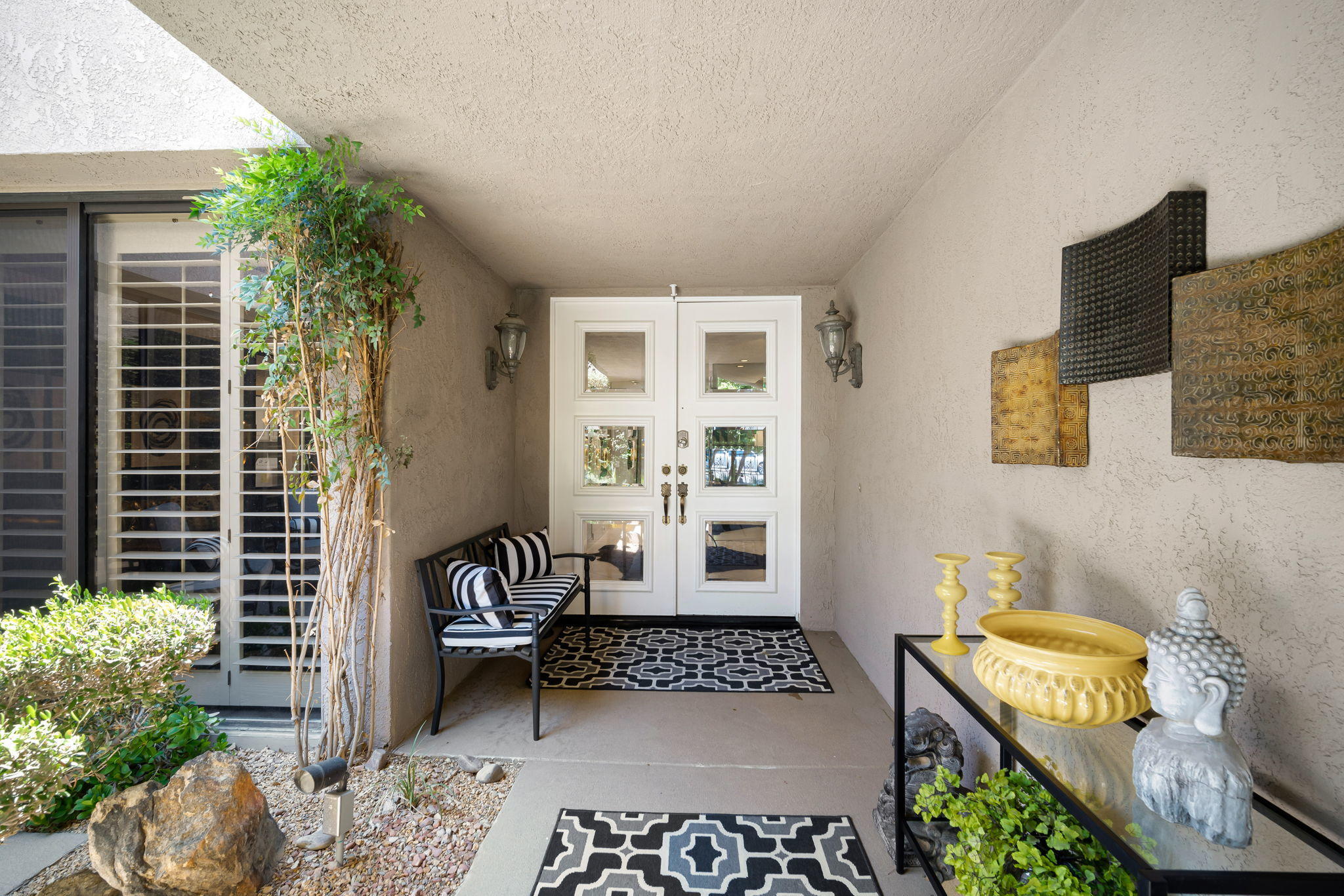 Undisclosed Address Rancho Mirage, CA 92270 - Photo 10 of 52 a living room with furniture and a potted plant