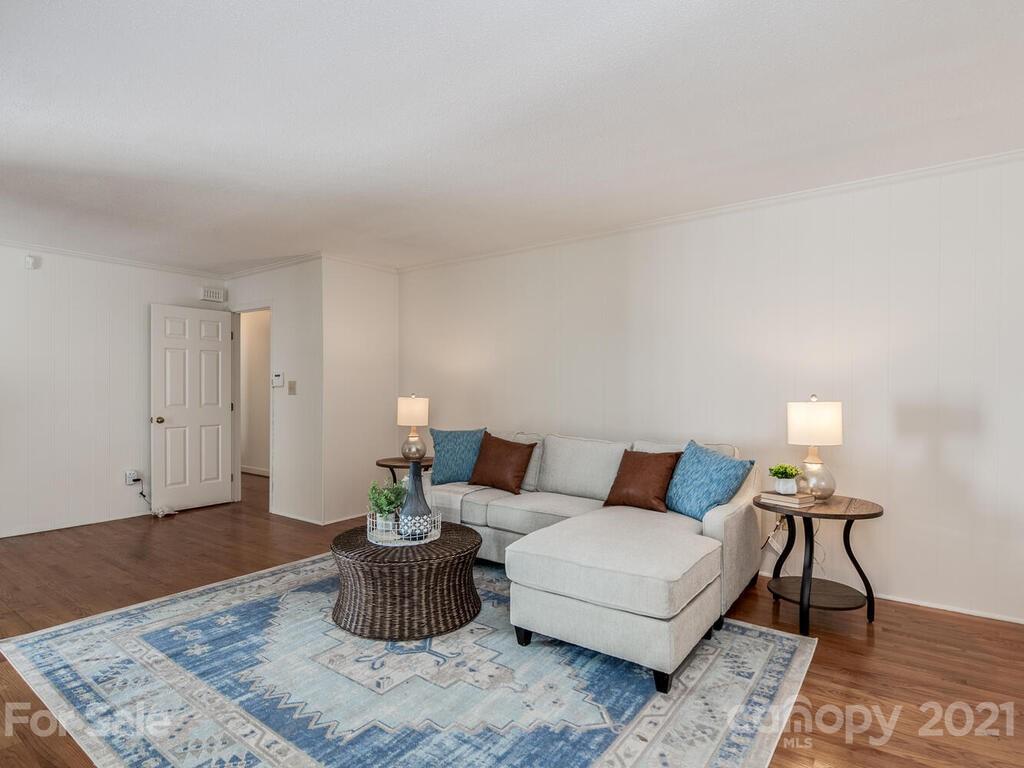 4920 Pine Ridge Road Charlotte, NC 28226 - Photo 13 of 28 a living room with furniture and a rug
