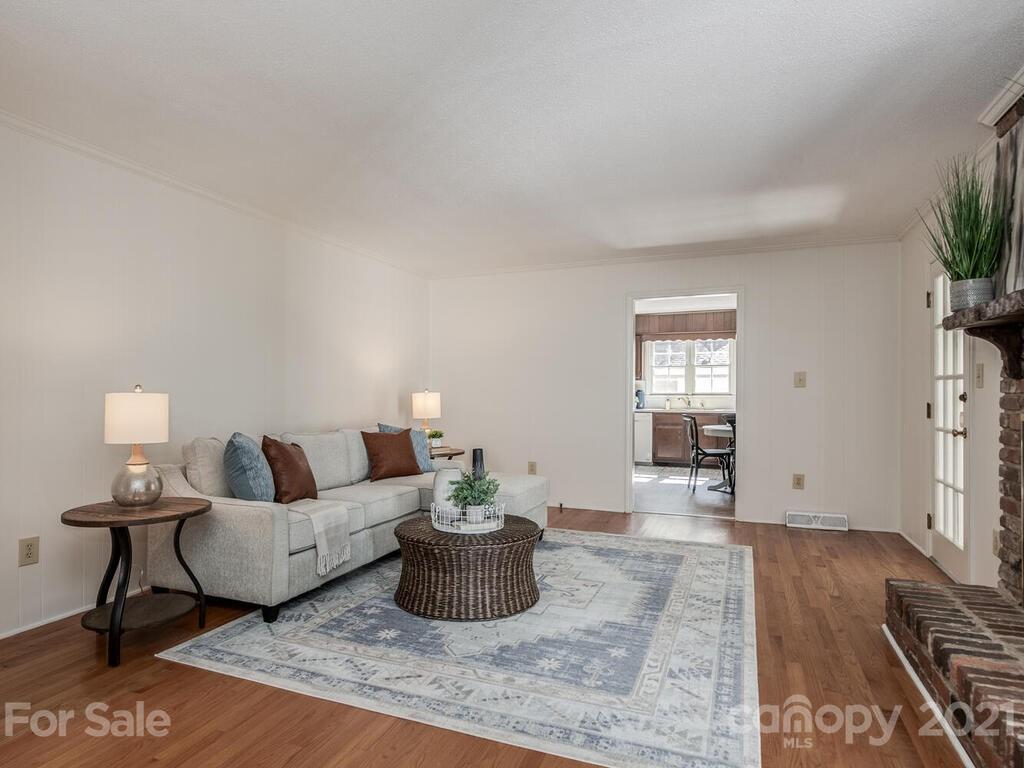 4920 Pine Ridge Road Charlotte, NC 28226 - Photo 14 of 28 a living room with furniture and a wooden floor