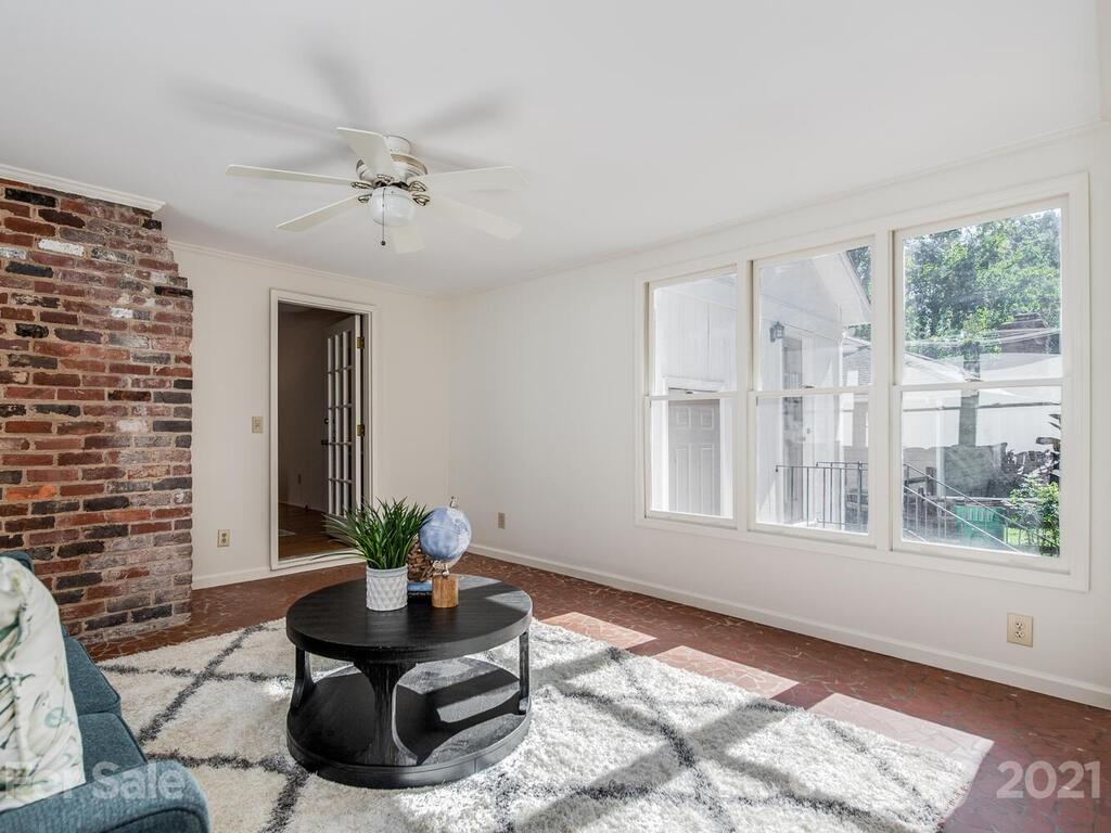 4920 Pine Ridge Road Charlotte, NC 28226 - Photo 16 of 28 a living room with furniture and a potted plant