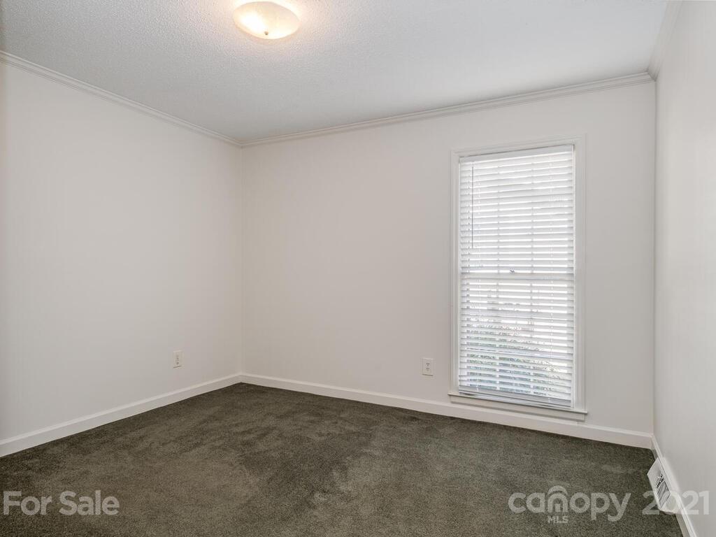 4920 Pine Ridge Road Charlotte, NC 28226 - Photo 20 of 28 an empty room with a window