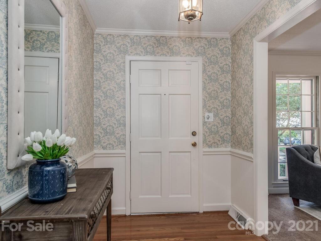 4920 Pine Ridge Road Charlotte, NC 28226 - Photo 3 of 28 a dining room with furniture and wooden floor