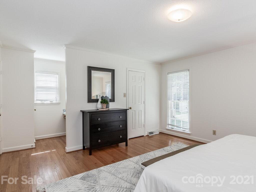 4920 Pine Ridge Road Charlotte, NC 28226 - Photo 23 of 28 a bedroom with a bed and a window