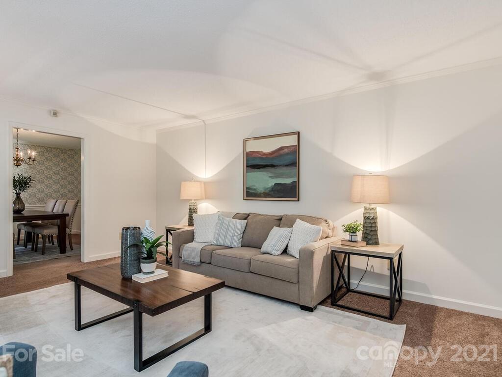 4920 Pine Ridge Road Charlotte, NC 28226 - Photo 5 of 28 a living room with furniture and a lamp