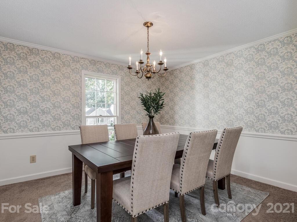 4920 Pine Ridge Road Charlotte, NC 28226 - Photo 6 of 28 a view of a dining room with furniture and window