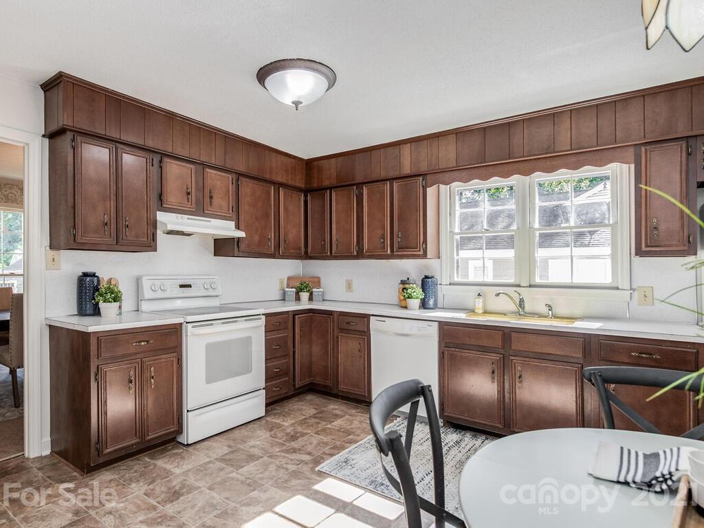 4920 Pine Ridge Road Charlotte, NC 28226 - Photo 7 of 28 a kitchen with a sink cabinets and window