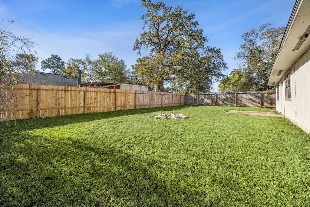 5602 Bridgegate Drive Spring, TX 77373 - Photo 16 of 17 a view of a yard with a large tree