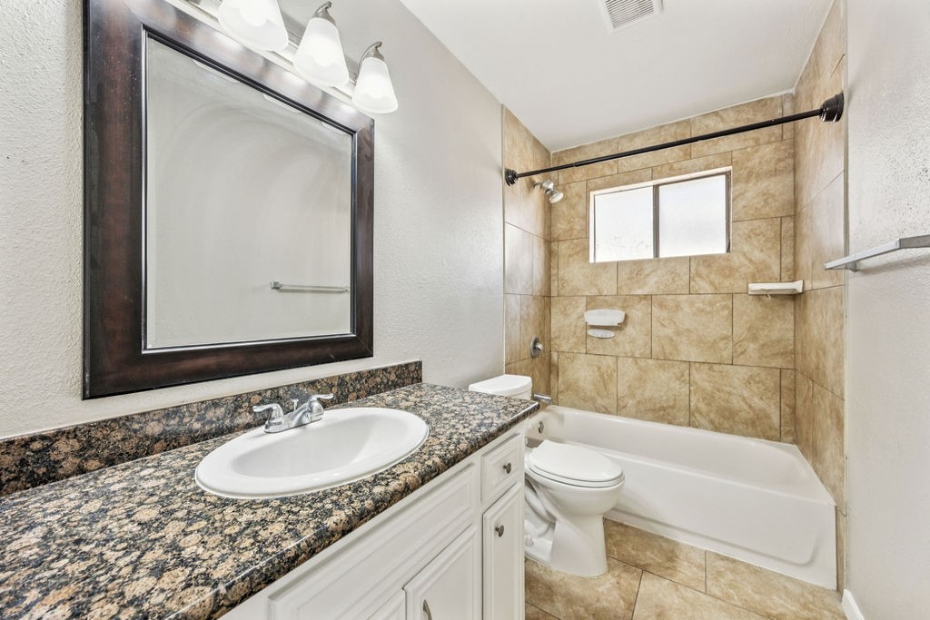 5602 Bridgegate Drive Spring, TX 77373 - Photo 10 of 17 a bathroom with a granite countertop sink toilet and shower