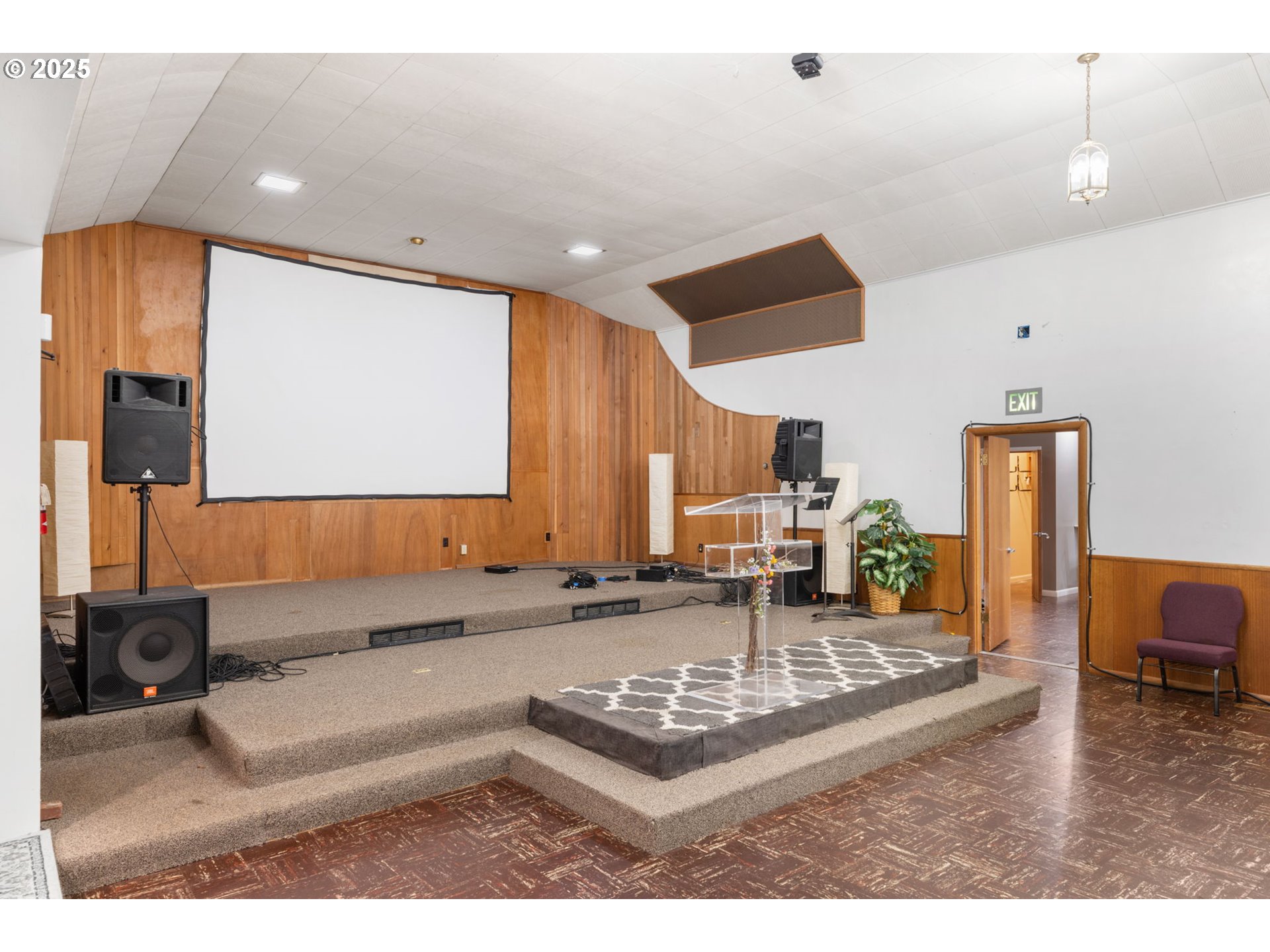 13047 Southeast Ramona Street Portland, OR 97236 - Photo 13 of 48 a kitchen with kitchen island granite countertop a sink and a refrigerator