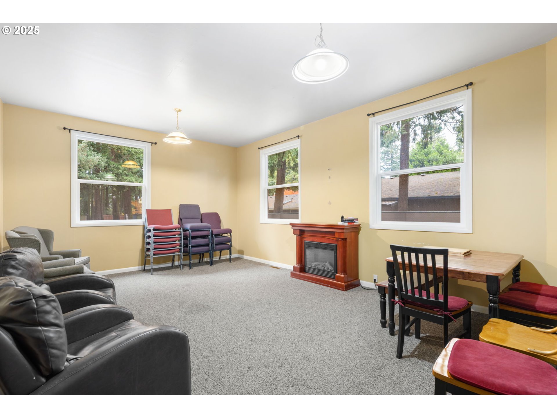 13047 Southeast Ramona Street Portland, OR 97236 - Photo 17 of 48 a living room with furniture and a dining table next to a window