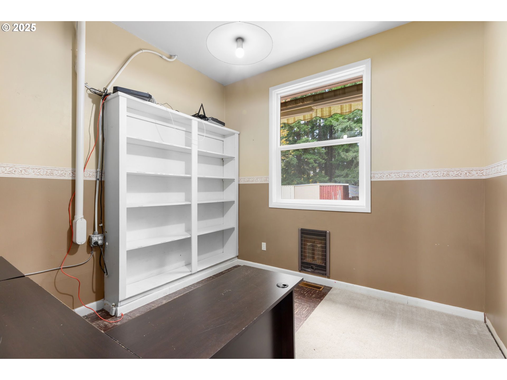 13047 Southeast Ramona Street Portland, OR 97236 - Photo 20 of 48 a view of room with window and cabinet