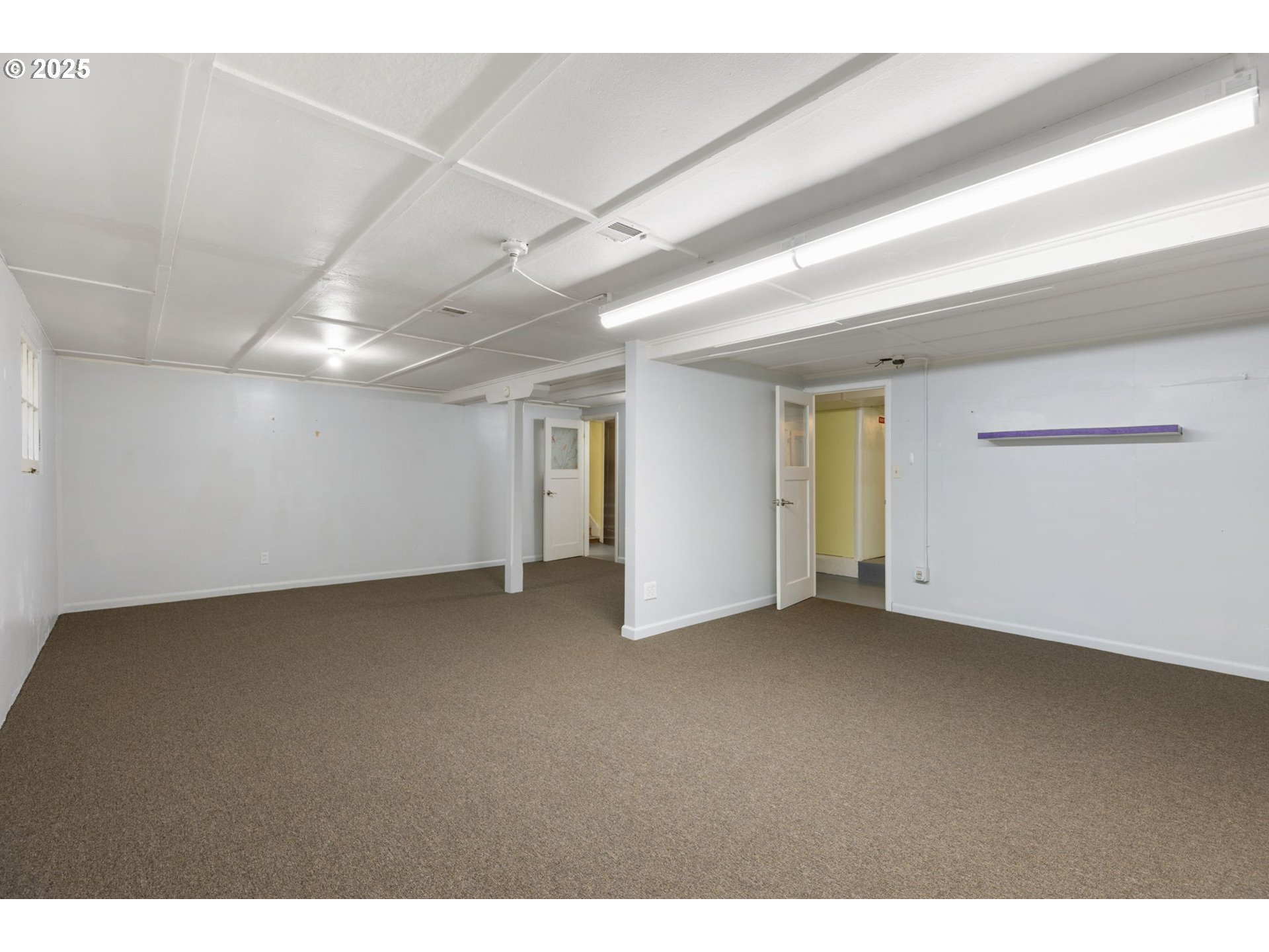 13047 Southeast Ramona Street Portland, OR 97236 - Photo 33 of 48 a view of an empty room with a window