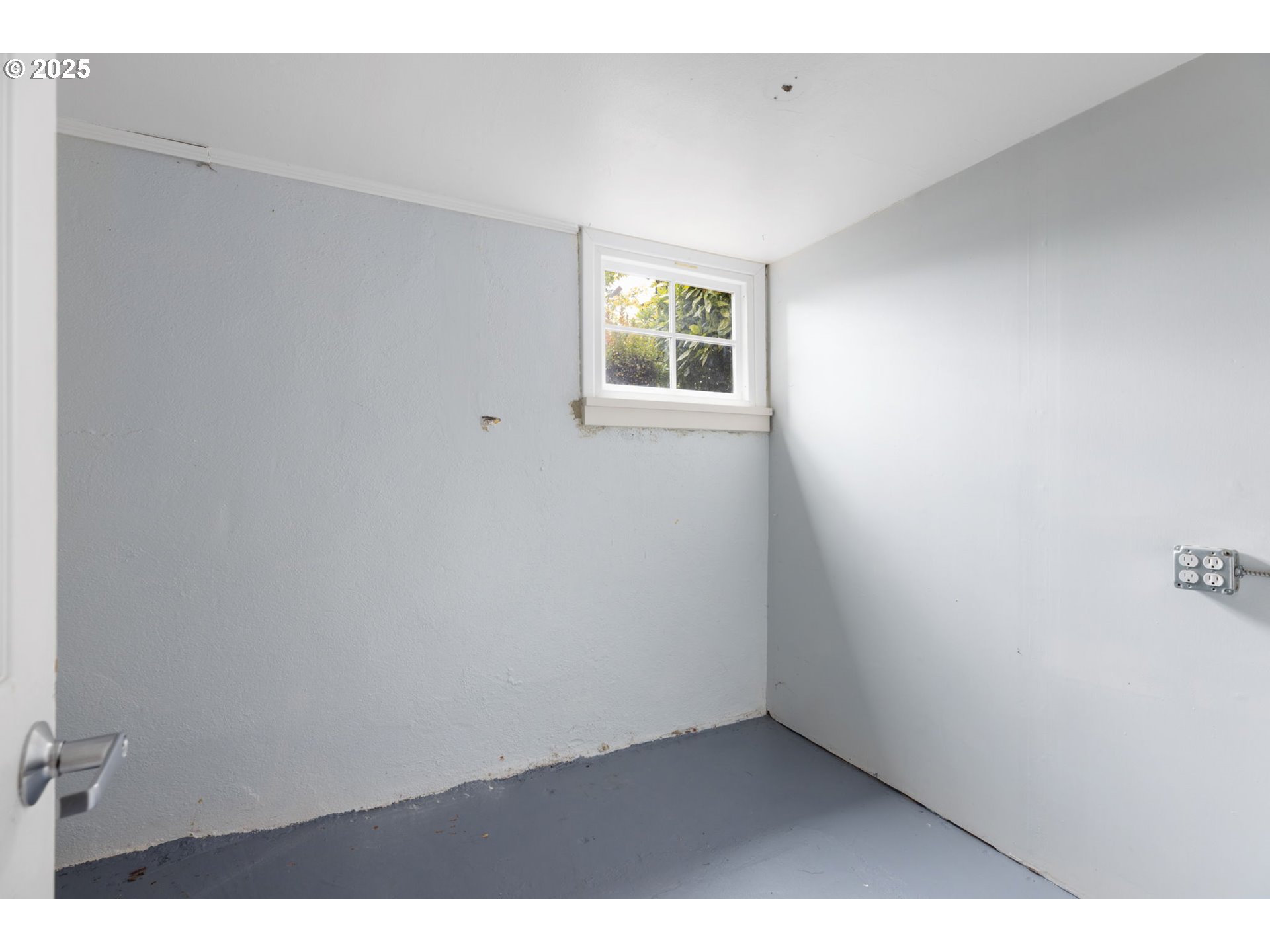 13047 Southeast Ramona Street Portland, OR 97236 - Photo 38 of 48 a view of an empty room with a window
