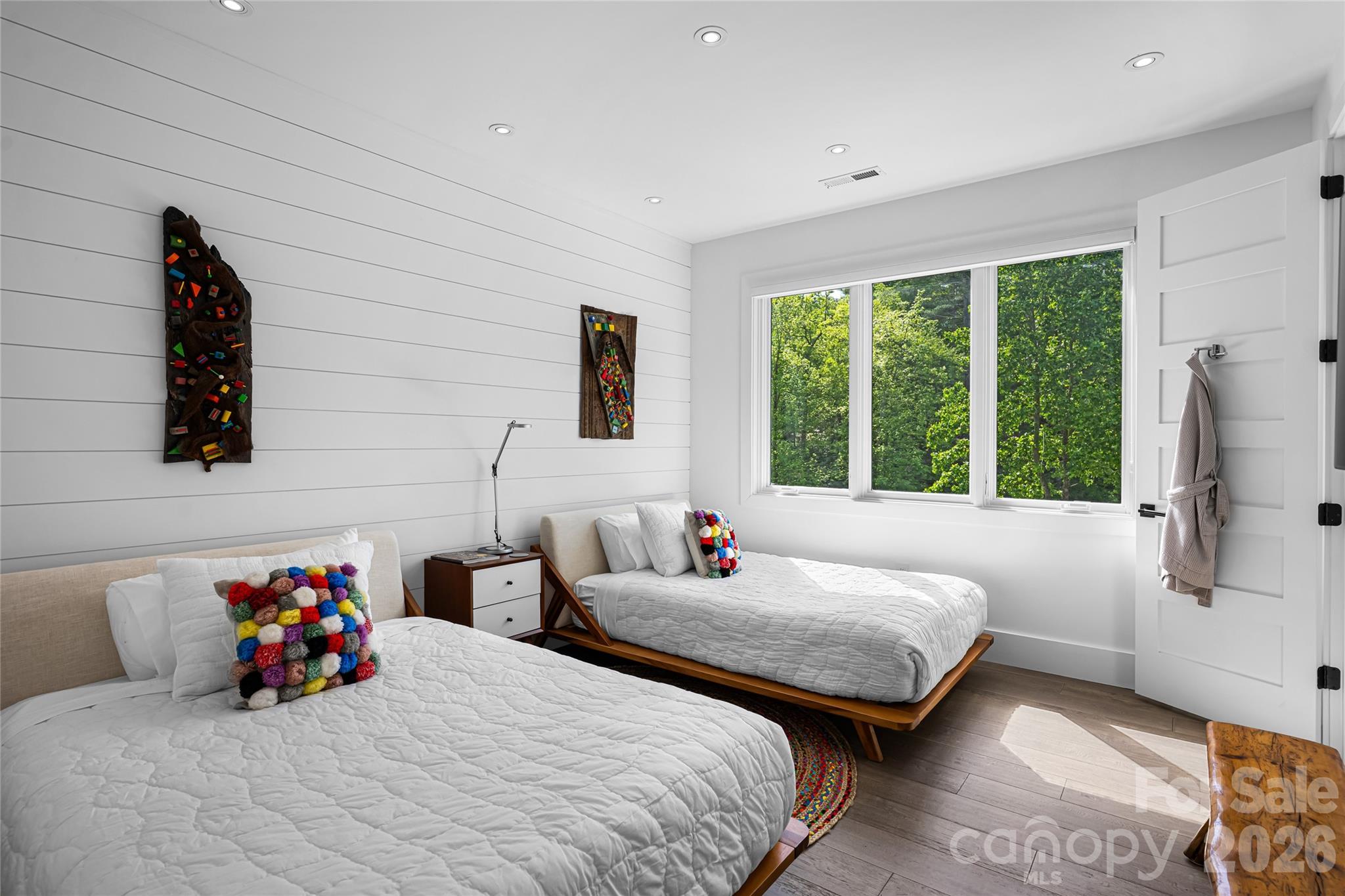 2235 Cold Mountain Road Lake Toxaway, NC 28747 - Photo 29 of 47 a bedroom with bed and a large window