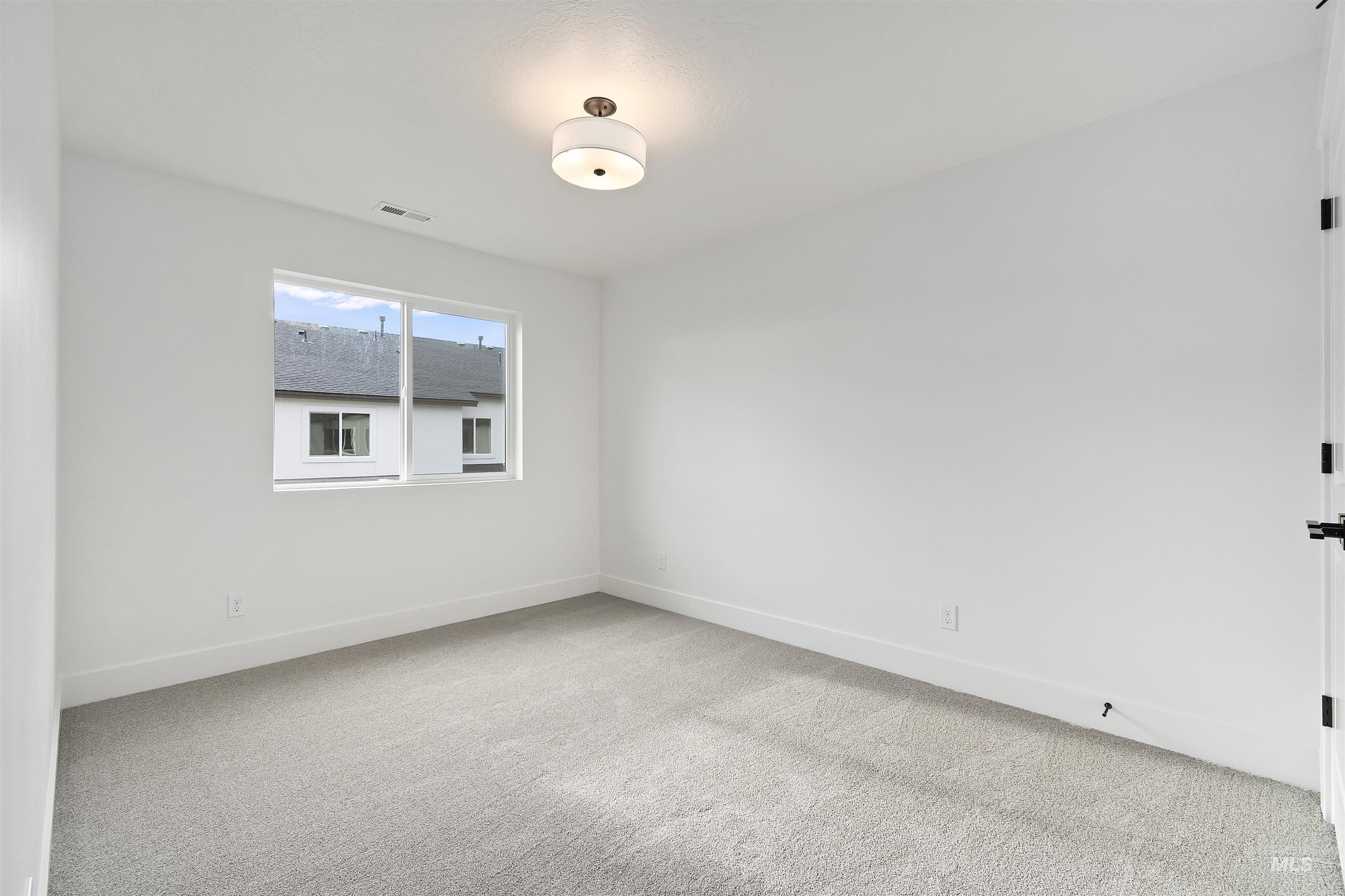 764 South Calhoun Lane Star, ID 83669 - Photo 31 of 48 Unfurnished room with light colored carpet and baseboards