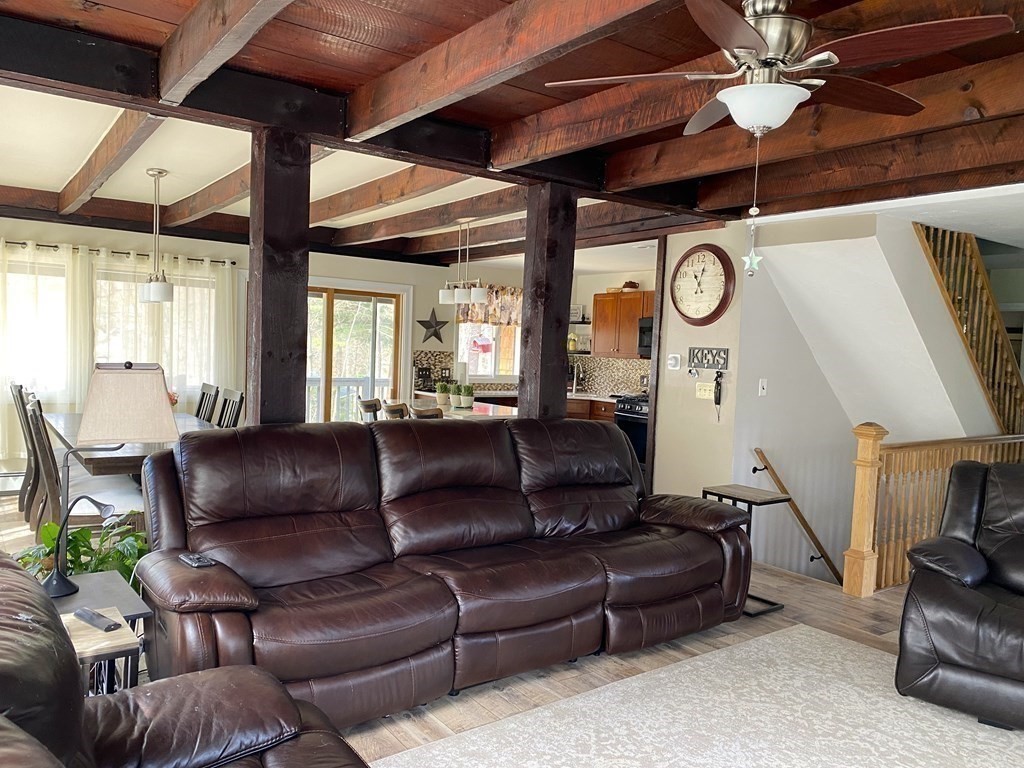 95 Franklin Street Douglas, MA 01516 - Photo 11 of 40 a living room with furniture and a clock