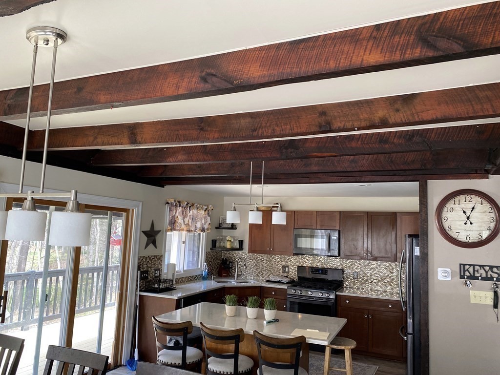 95 Franklin Street Douglas, MA 01516 - Photo 16 of 40 a kitchen view with a chair and cabinets