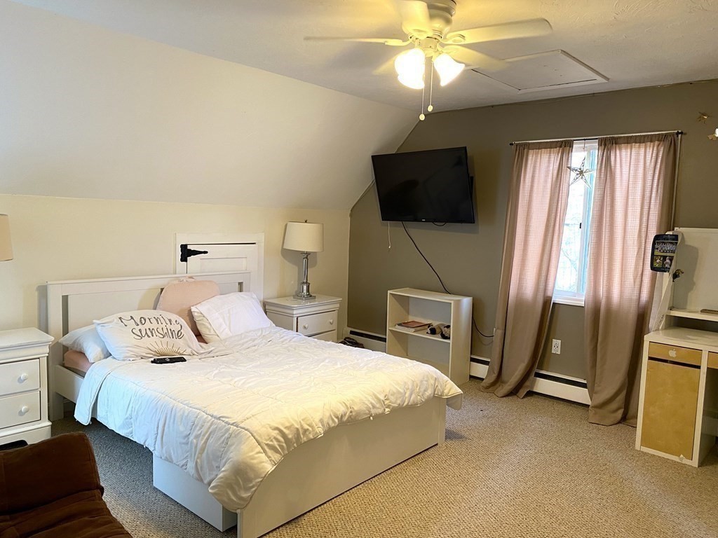 95 Franklin Street Douglas, MA 01516 - Photo 28 of 40 a bedroom with a bed and a flat screen tv