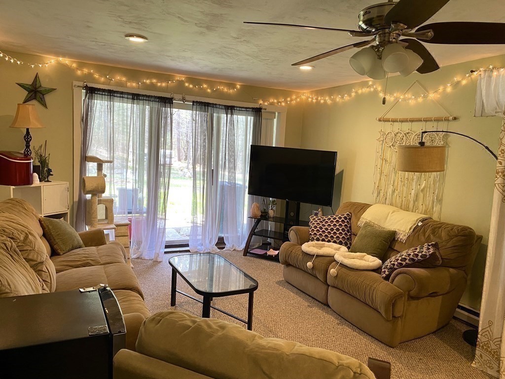 95 Franklin Street Douglas, MA 01516 - Photo 30 of 40 a living room with furniture and a flat screen tv