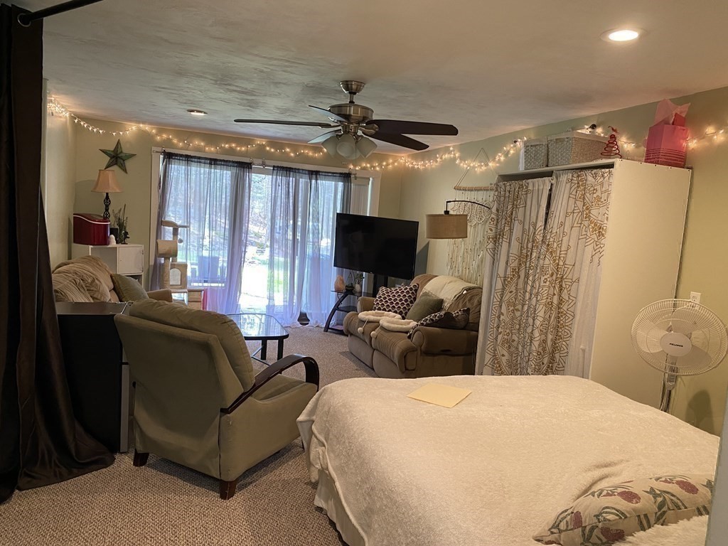 95 Franklin Street Douglas, MA 01516 - Photo 31 of 40 a bedroom with a bed couch and a window