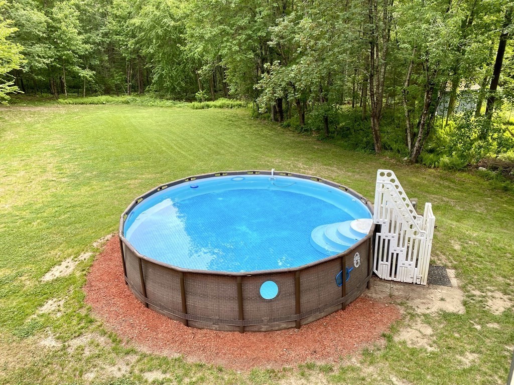 95 Franklin Street Douglas, MA 01516 - Photo 36 of 40 a view of a swimming pool with a yard