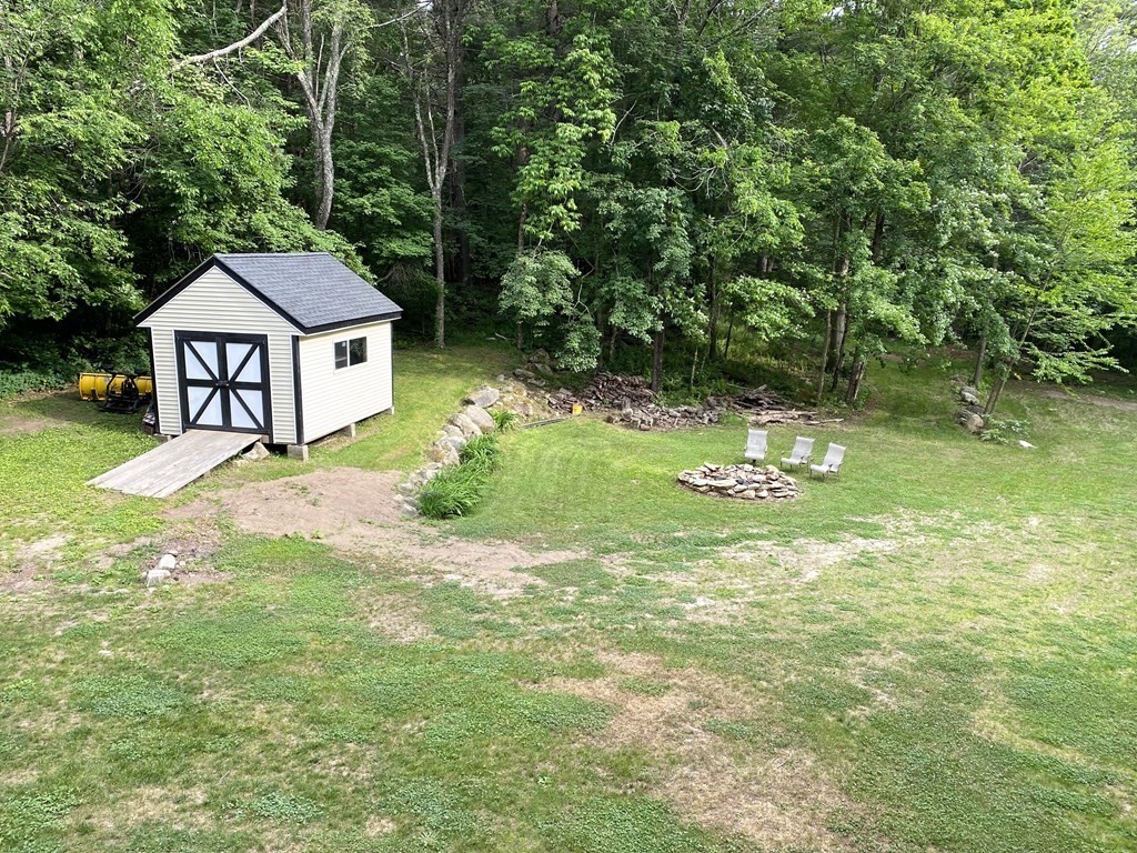 95 Franklin Street Douglas, MA 01516 - Photo 37 of 40 a view of a house with a yard and a fence
