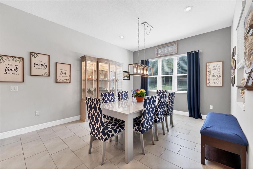 13306 Deep Blue Place Bradenton, FL 34211 - Photo 16 of 73 a view of a dining room with furniture