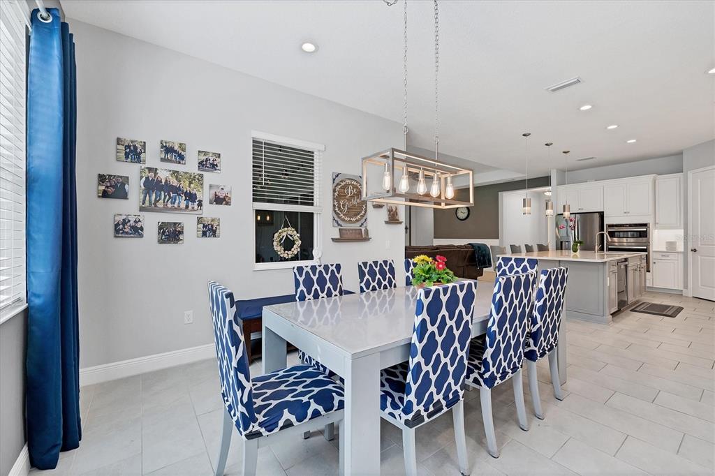 13306 Deep Blue Place Bradenton, FL 34211 - Photo 18 of 73 a view of a dining room with furniture
