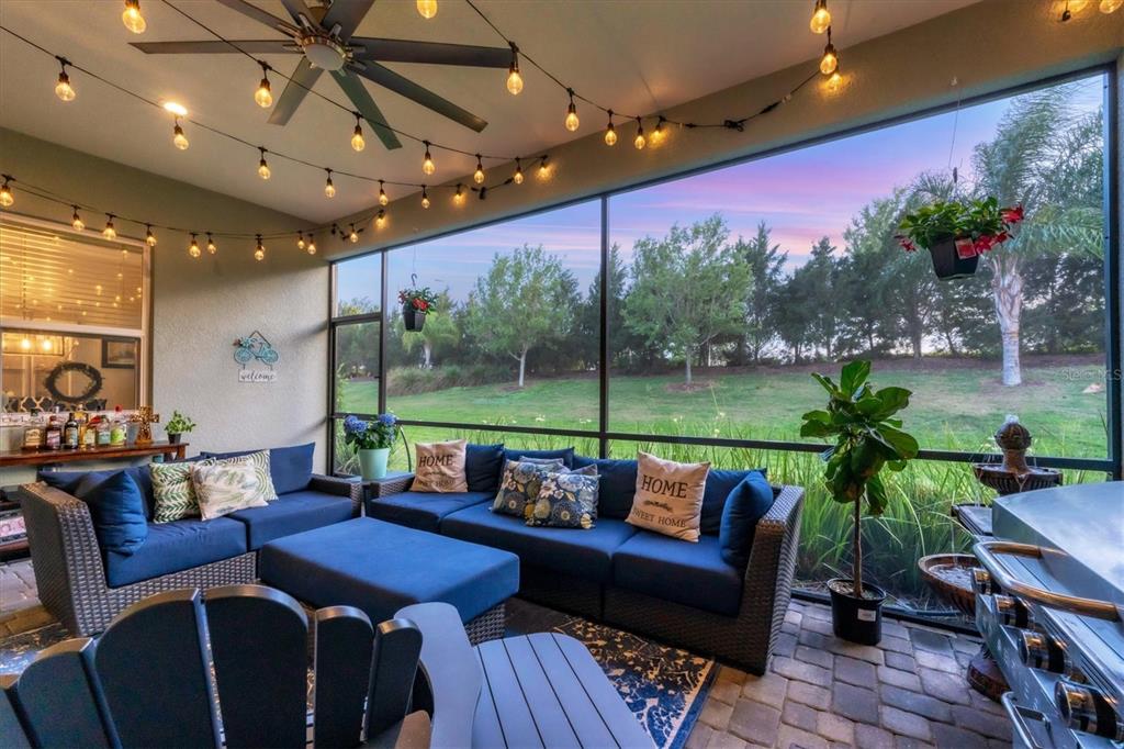 13306 Deep Blue Place Bradenton, FL 34211 - Photo 3 of 73 a roof deck with couches and potted plants with wooden floor
