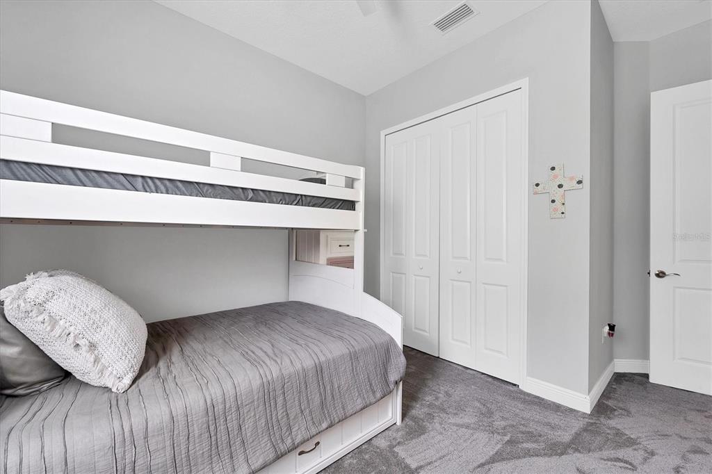 13306 Deep Blue Place Bradenton, FL 34211 - Photo 32 of 73 a bedroom with a bed and a window