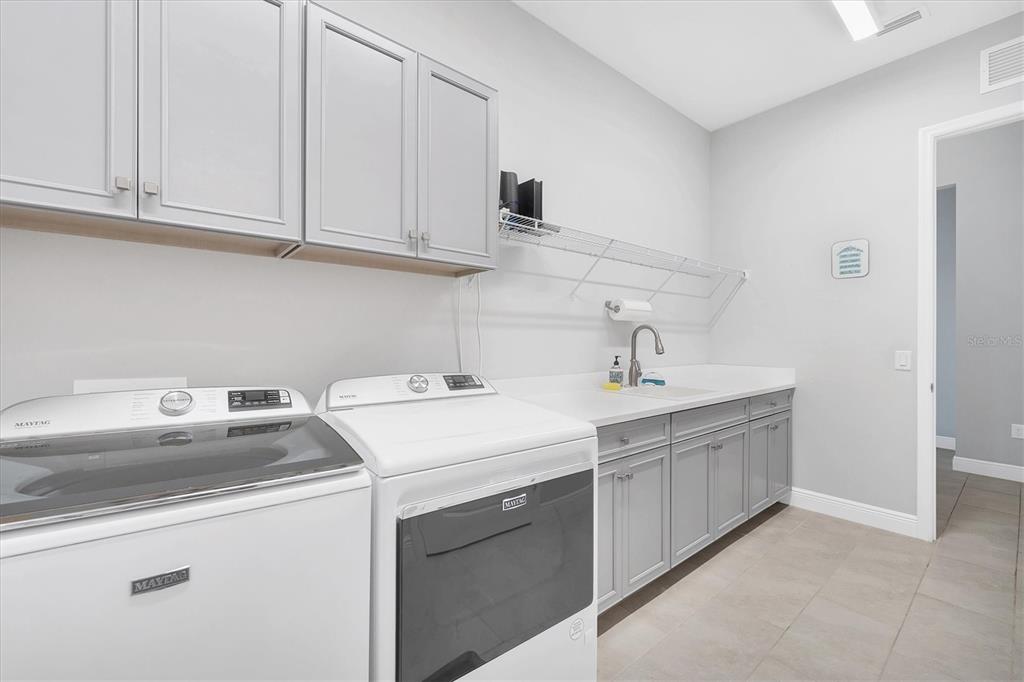 13306 Deep Blue Place Bradenton, FL 34211 - Photo 40 of 73 a utility room with sink dryer and washer