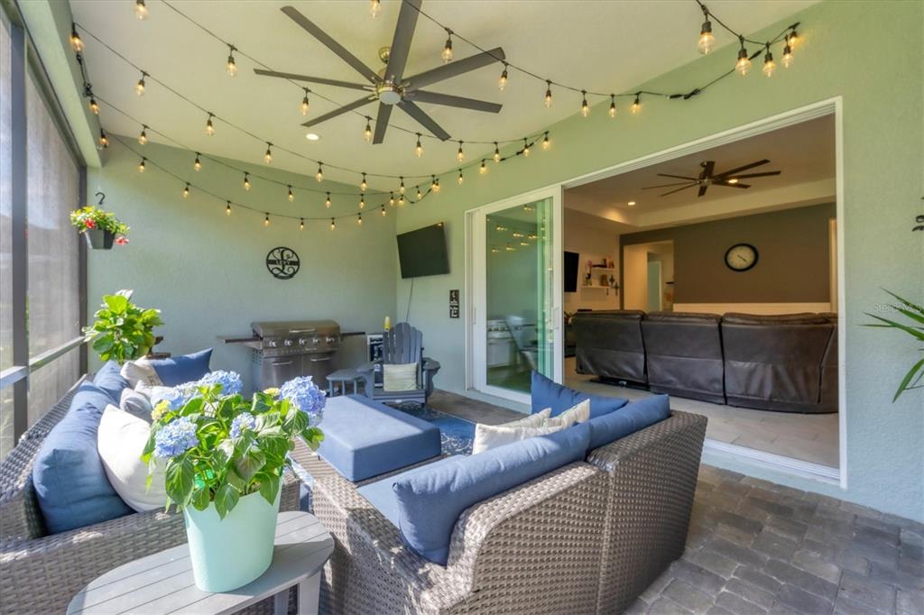 13306 Deep Blue Place Bradenton, FL 34211 - Photo 43 of 73 a living room with furniture and a chandelier