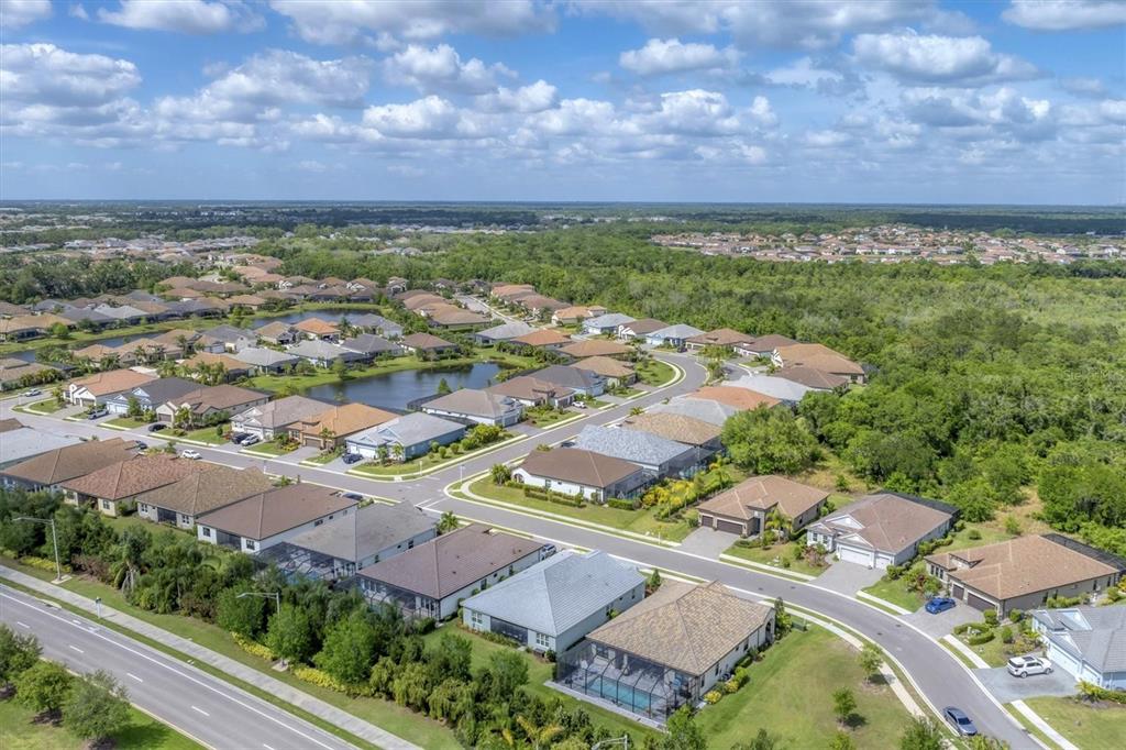 13306 Deep Blue Place Bradenton, FL 34211 - Photo 53 of 73 an aerial view of residential houses with outdoor space
