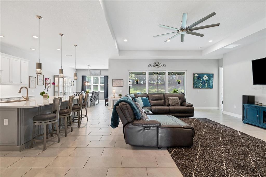 13306 Deep Blue Place Bradenton, FL 34211 - Photo 7 of 73 a living room with furniture and a flat screen tv