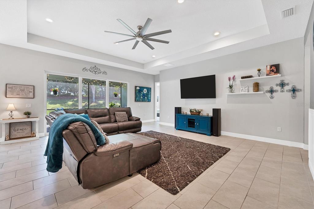 13306 Deep Blue Place Bradenton, FL 34211 - Photo 8 of 73 a living room with furniture and a flat screen tv