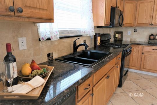 1516 Mayo Street Ridgecrest, CA 93555 - Photo 13 of 33 a kitchen with stainless steel appliances a sink and cabinets