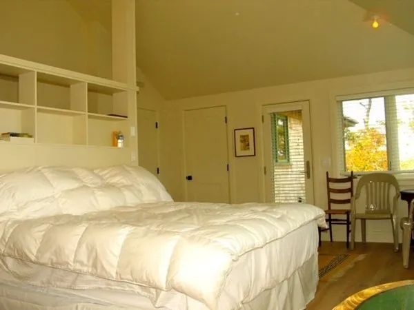 a bedroom with a bed and painted walls