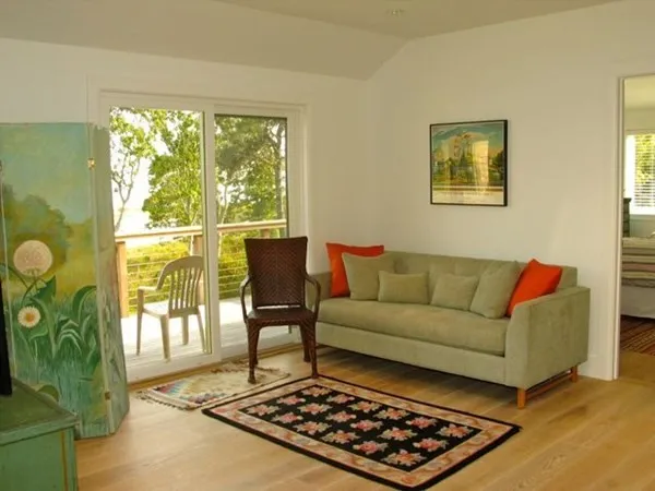 a living room with furniture and a rug