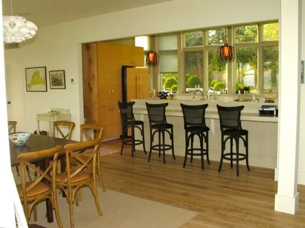 a view of a dining room with furniture and window