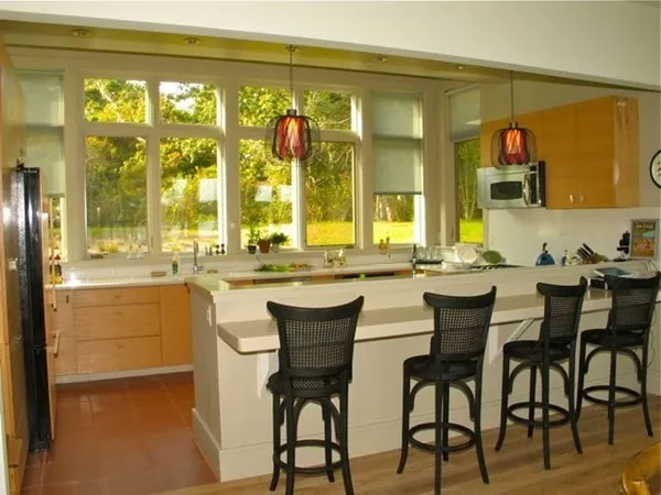 a dining table with chairs and window