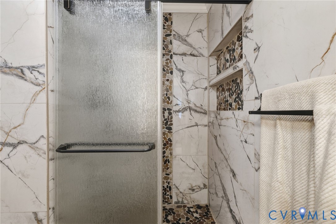13411 Queensgate Road Midlothian, VA 23114 - Photo 23 of 37 Marble & tile shower with pebble accents and built