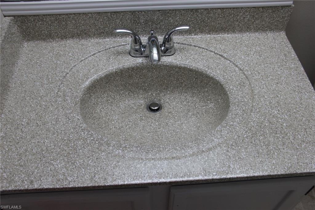 5841 Rattlesnake Hammock Road, Unit I206 Naples, FL 34113 - Photo 16 of 24 a bathroom with a sink