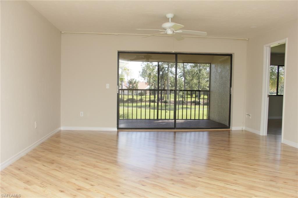 5841 Rattlesnake Hammock Road, Unit I206 Naples, FL 34113 - Photo 17 of 24 wooden floor in an empty room with a window