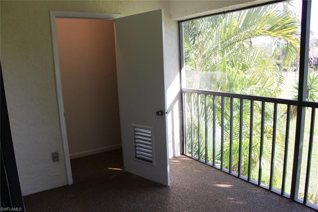 5841 Rattlesnake Hammock Road, Unit I206 Naples, FL 34113 - Photo 18 of 24 a view of hallway with windows