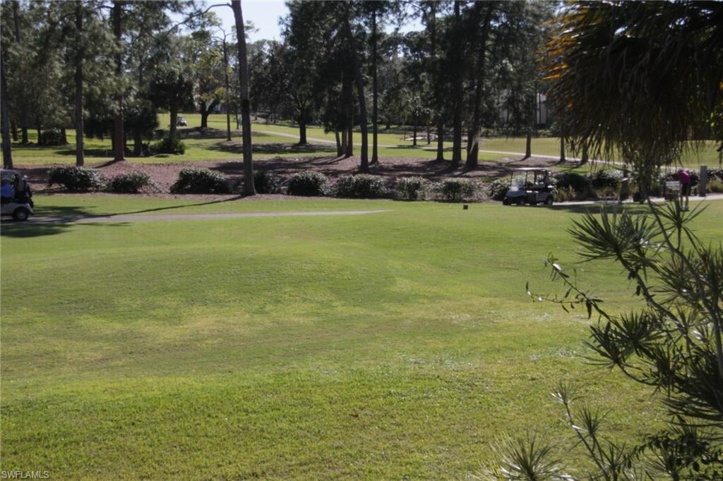 5841 Rattlesnake Hammock Road, Unit I206 Naples, FL 34113 - Photo 20 of 24 a huge green field with lots of trees