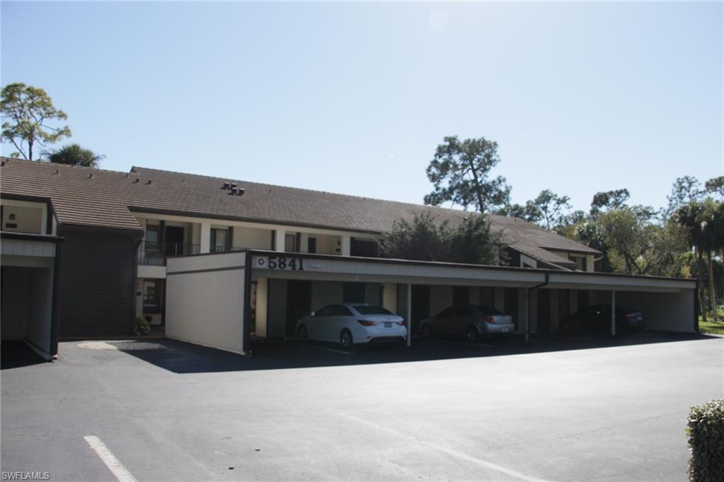 5841 Rattlesnake Hammock Road, Unit I206 Naples, FL 34113 - Photo 2 of 24 a front view of house with a yard