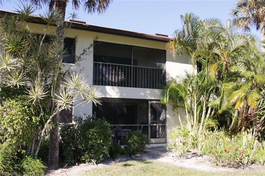 5841 Rattlesnake Hammock Road, Unit I206 Naples, FL 34113 - Photo 22 of 24 a backyard of a house