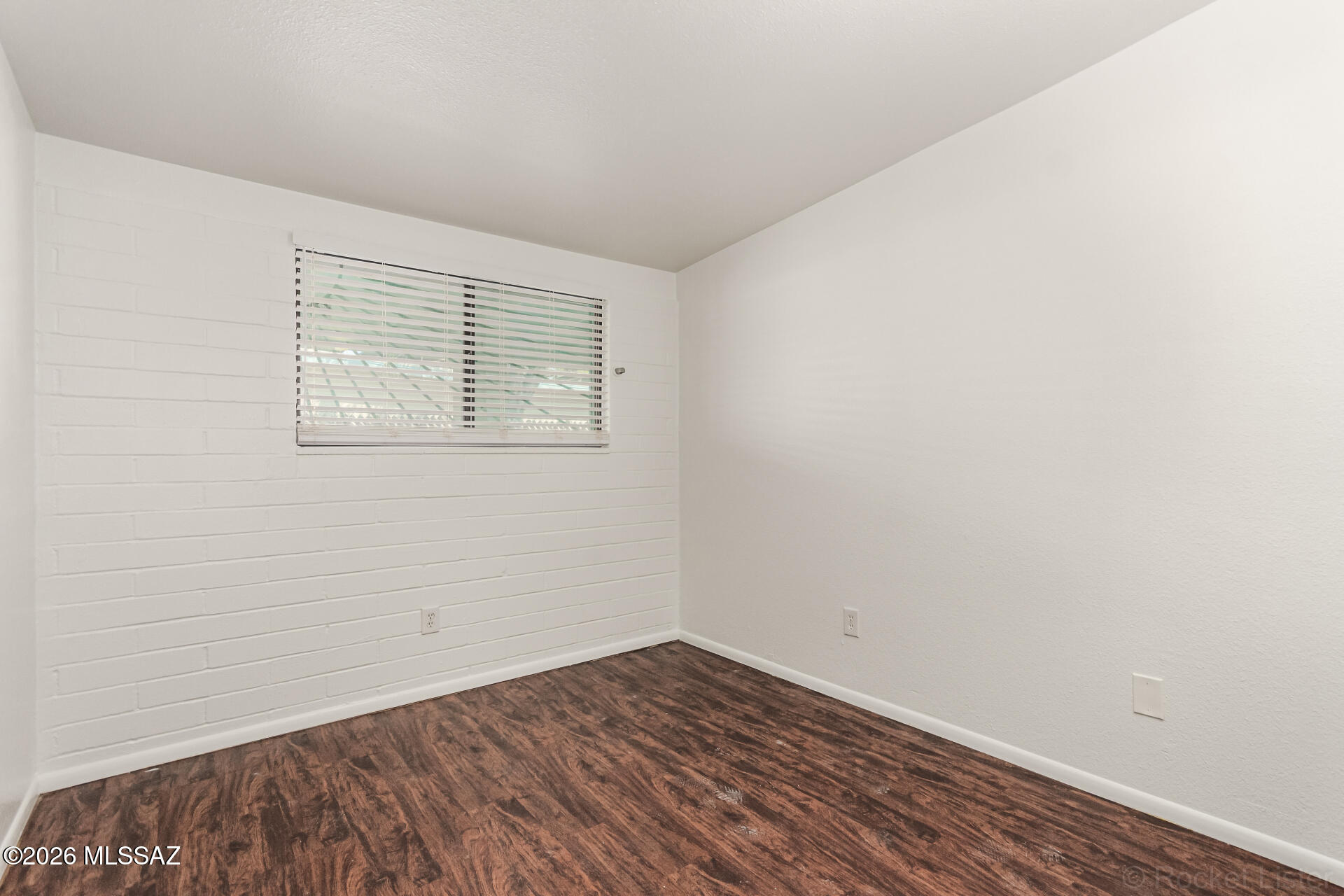 17 East Los Reales Road Tucson, AZ 85756 - Photo 17 of 27 wooden floor in an empty room with a window