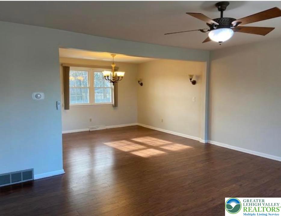 2700 Van Buren Road Easton, PA 18045 - Photo 2 of 21 an empty room with wooden floor fan and windows